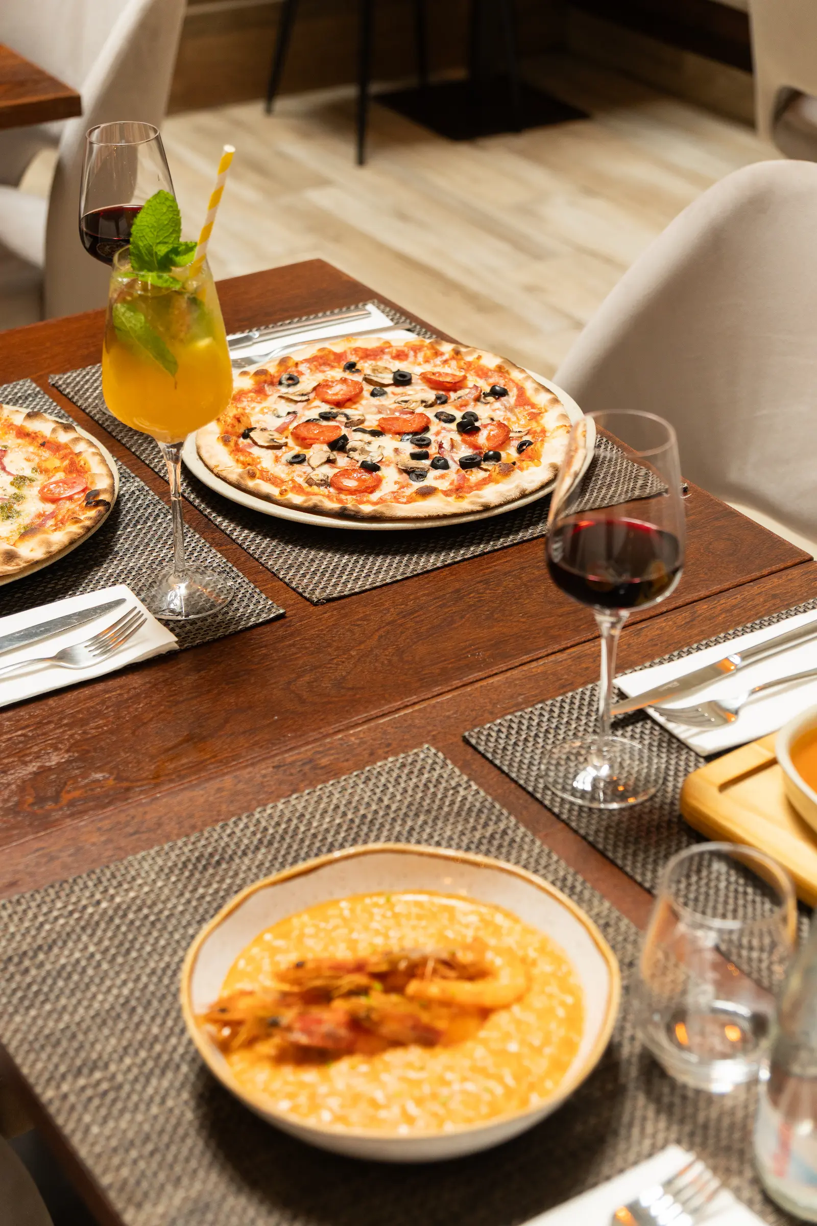 Artisan pizza on a set table with cutlery