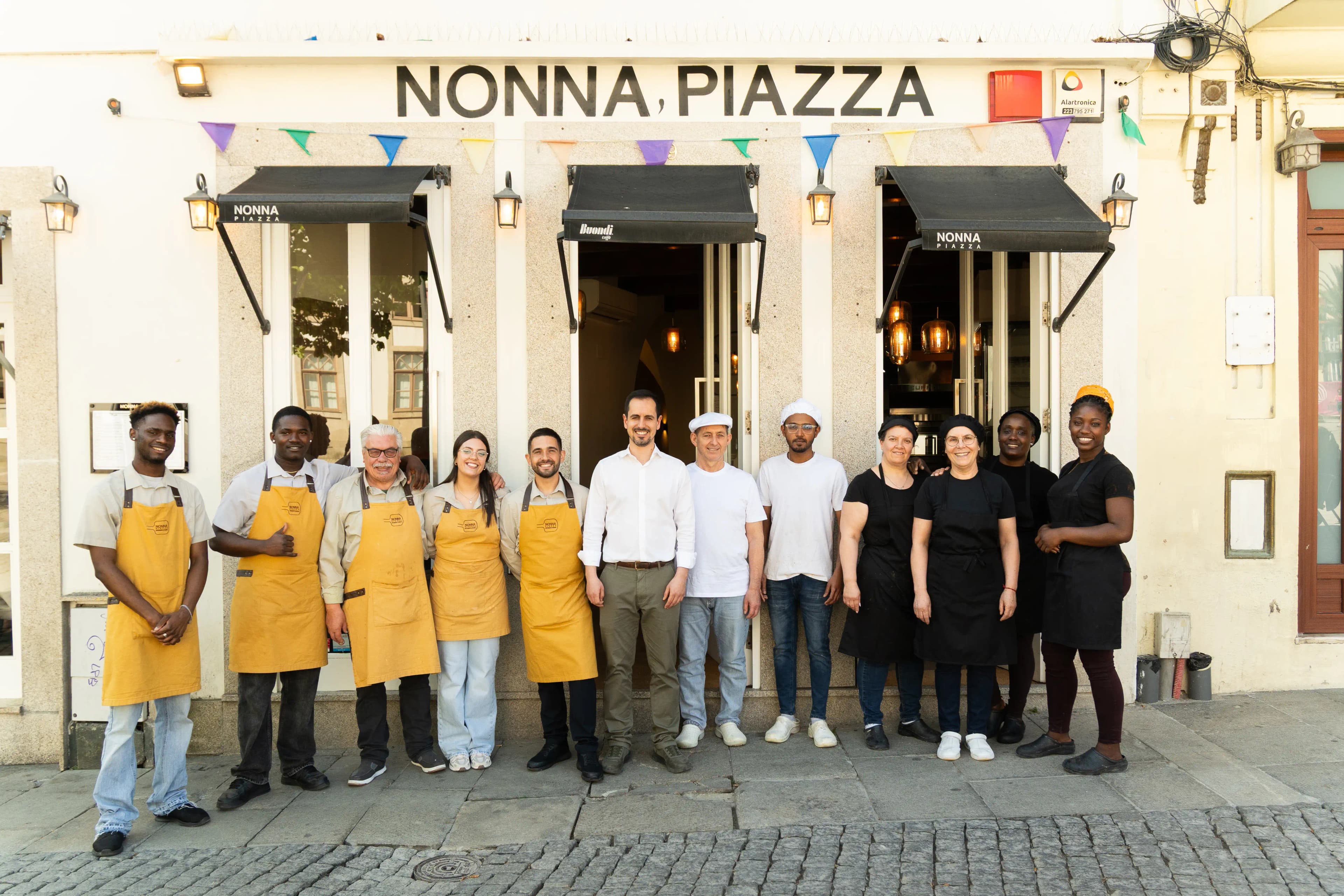 Nonna Piazza team in front of the restaurant in Porto